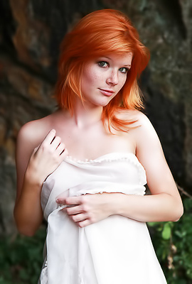 >Sexy redhead amateur Mia Sollis nude in the forest