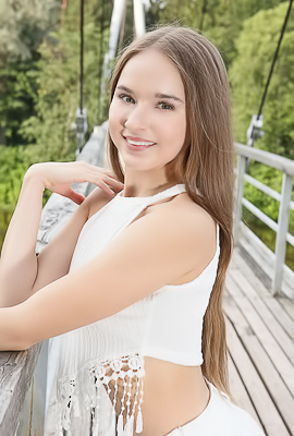 Sasha Quinn Smiling Playfully As Her Short Skirt Flips Up To Reveal She’s Not Wearing Panties