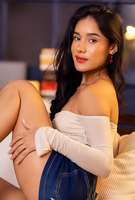 >Carolina Guerrero Seduces In Her Bedroom Wearing Denim Shorts And A White Top Whispering Temptation