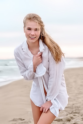Luise Entices With A Beach Striptease Revealing Perky Nipples And Grabbing Her Curves