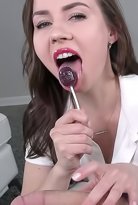 >Lana Blade swirls candy into your mouth while edging your balls with a teasing handjob