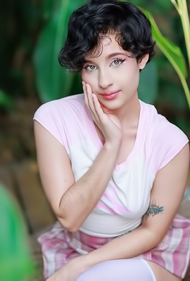 >Dakota Jhons gives deepthroat blowjob on white couch in bedroom with green pillow and blue blanket